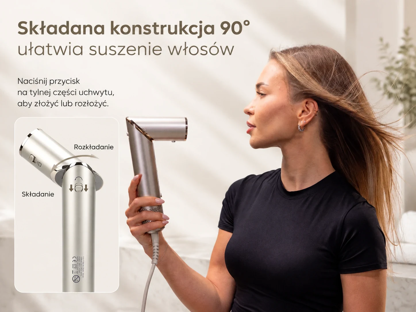 Kobieta trzyma lok&oacute;wko-suszarkę z rączką ustawioną pod kątem 90 stopni
