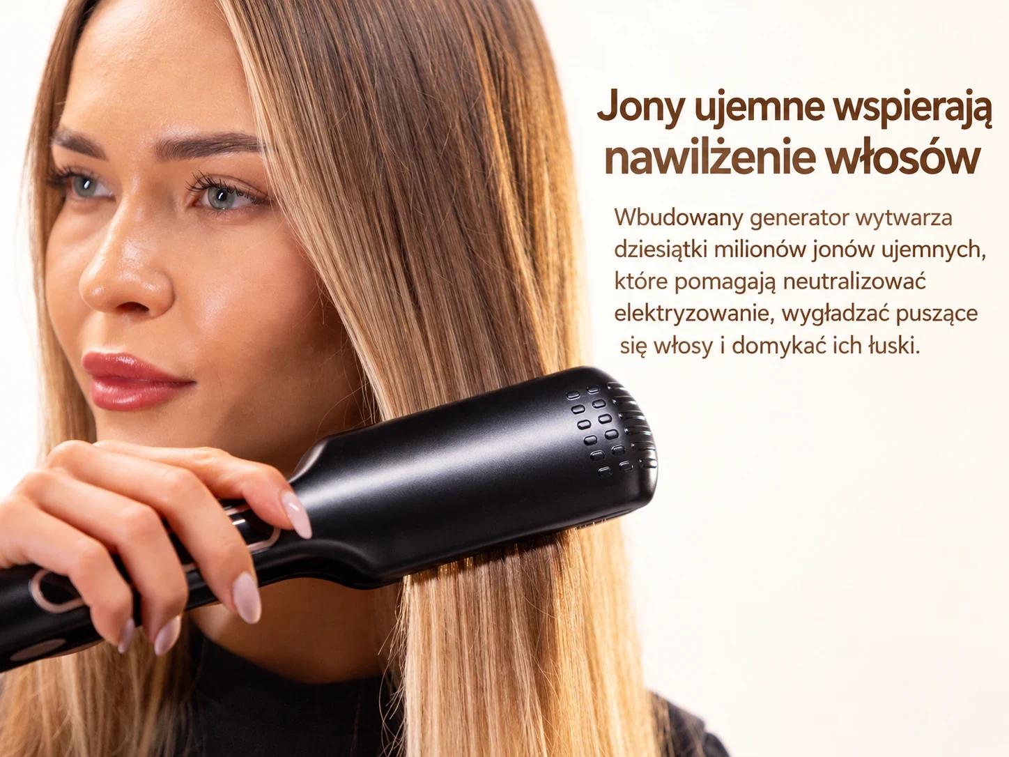 Czarna prostownica przesuwana po długich, prostych włosach